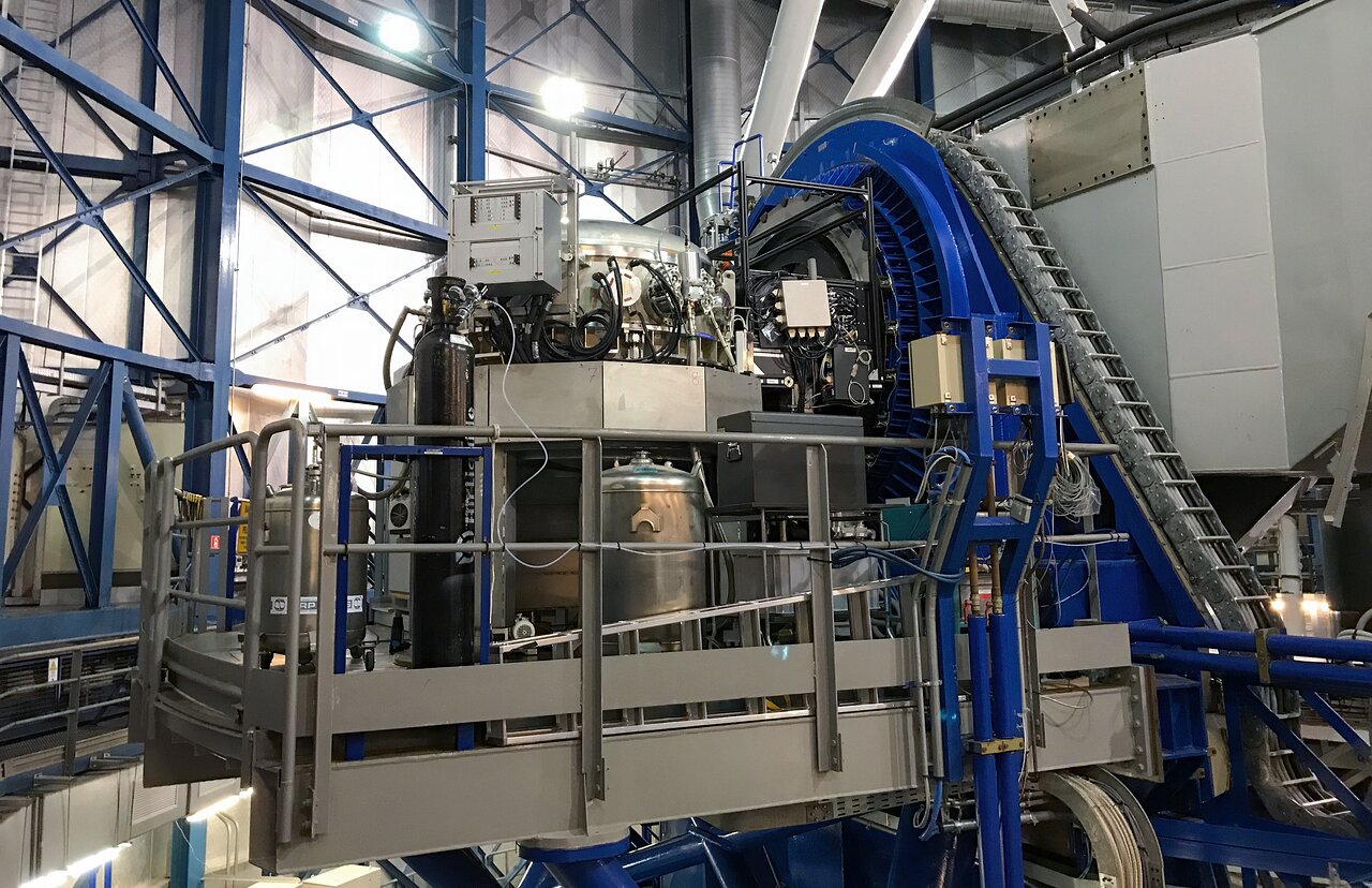Photograph showing the CRIRES+ spectrograph at the nasmyth focus of the Very Large Telescope.