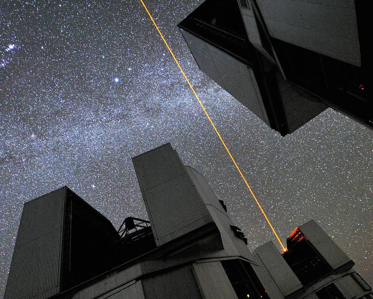 Photograph taken lying down at the paranal observatory, showing Very large telescope unit telescope and the sky.